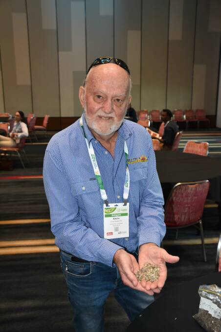 Kevin Charlesworth with a handful of sunflower seed at the Australian Summer Grains Conference. Photo by Gregor Heard.