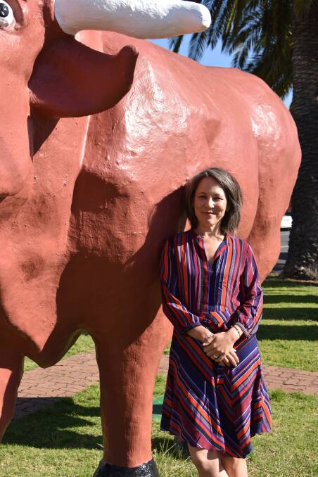 Author Gabrielle Chan with the iconic Mallee Bull in Birchip.