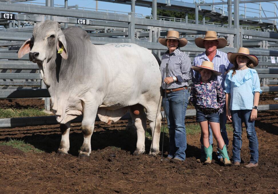 The Williamson family of Capricorn Brahmans, Emerald, with the $130,000 equal top price grey bull of the 2022 sale, Capricorn B Sydney. Picture by Kent Ward 