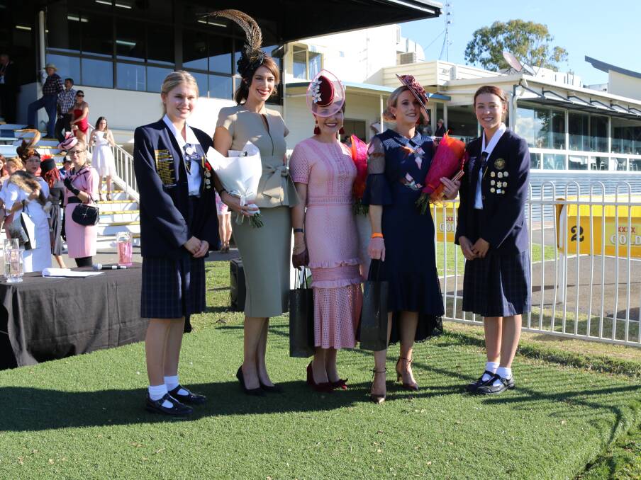 Fashion stakes: The winners of the 2017 Rockhampton Girls Grammar School Race Day Fashions on the Field competition pose with RGGS students.