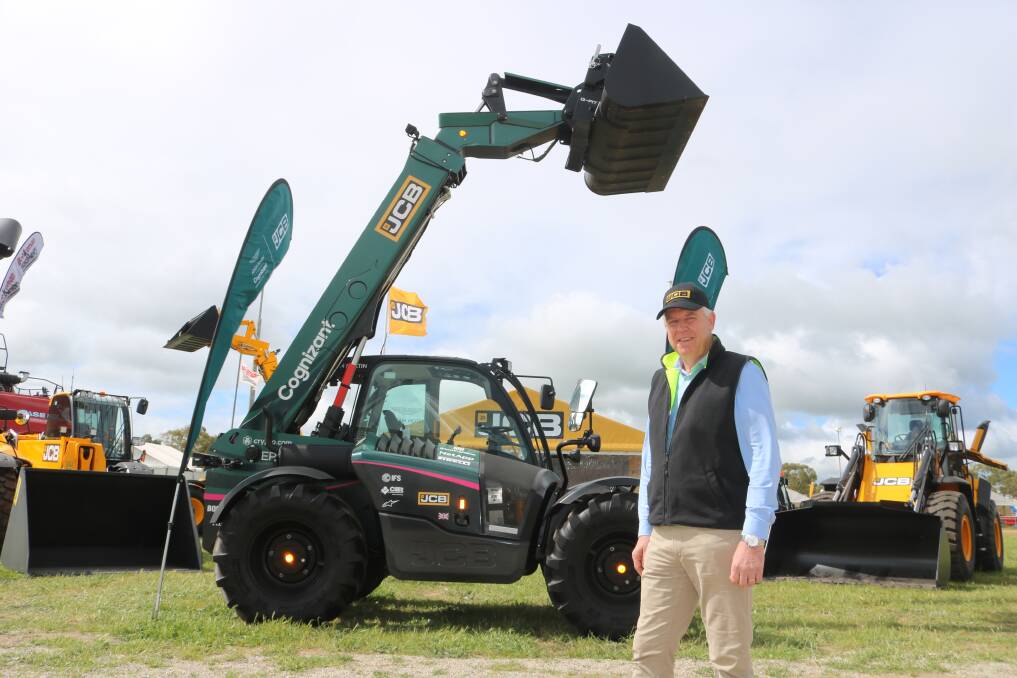 JCB general manager Western Australia, Renay van der Meulen, with the Aston Martin race green telehandler on display at the recent Dowerin GWN7 Machinery Days. 