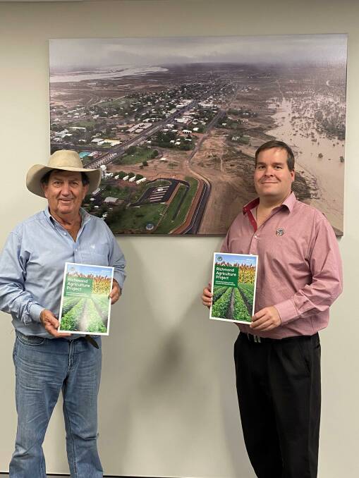 Richmond Shire Mayor John Wharton and CEO Peter Bennett display the agriculture project overview brochure they're using to seek funding.