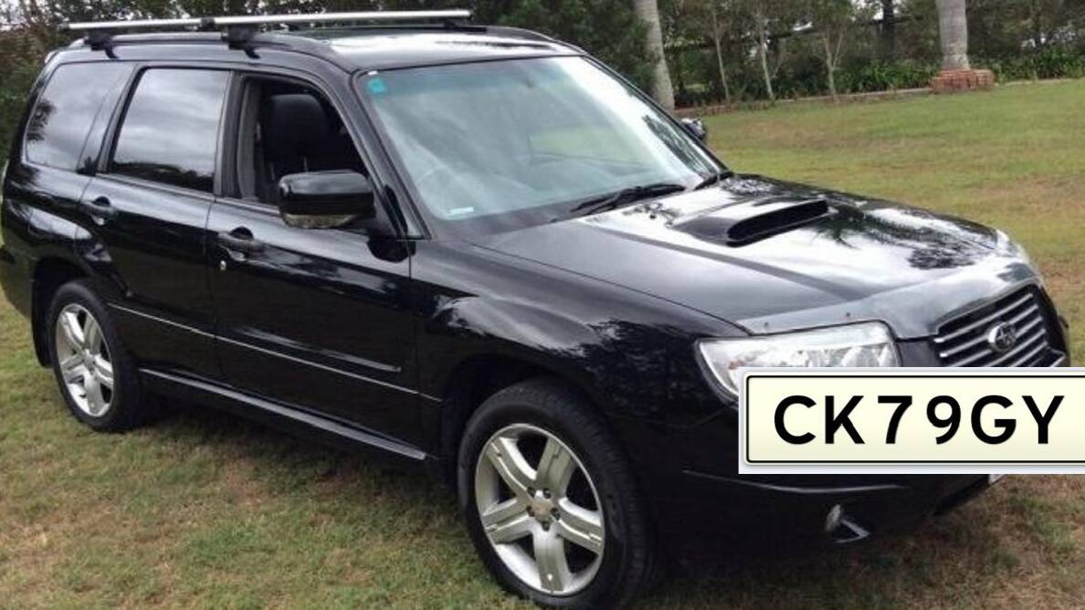 A dark-coloured Subaru Forester bearing NSW registration CK79GY was seen leaving the scene of the house fire.