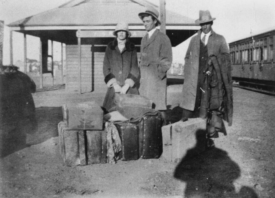 Passengers waiting with their luggage at the Yaraka station. Photo sourced from State Library of Queensland.