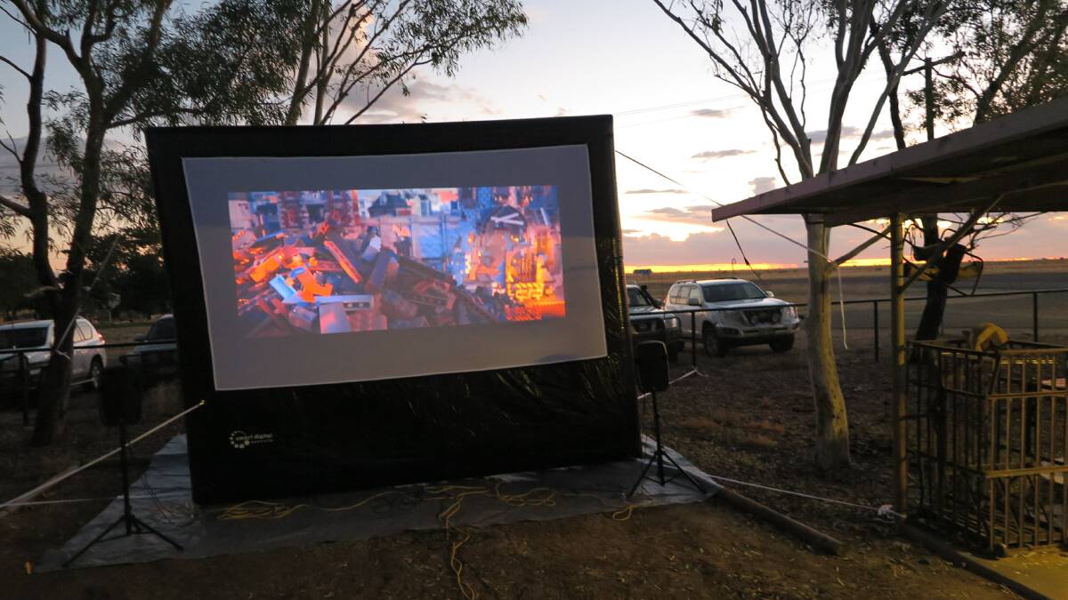 A portable screen set up to play movies in a backyard on a remote Longreach property. Photo supplied.