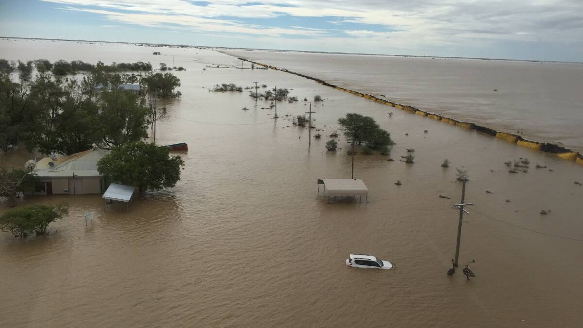 Overwhelmed: The tiny town of Nelia in the McKinlay shire, a safe spot in past floods, was totally inundated, along with a QR train. Photo: Salvation Army, Outback Flying Service.