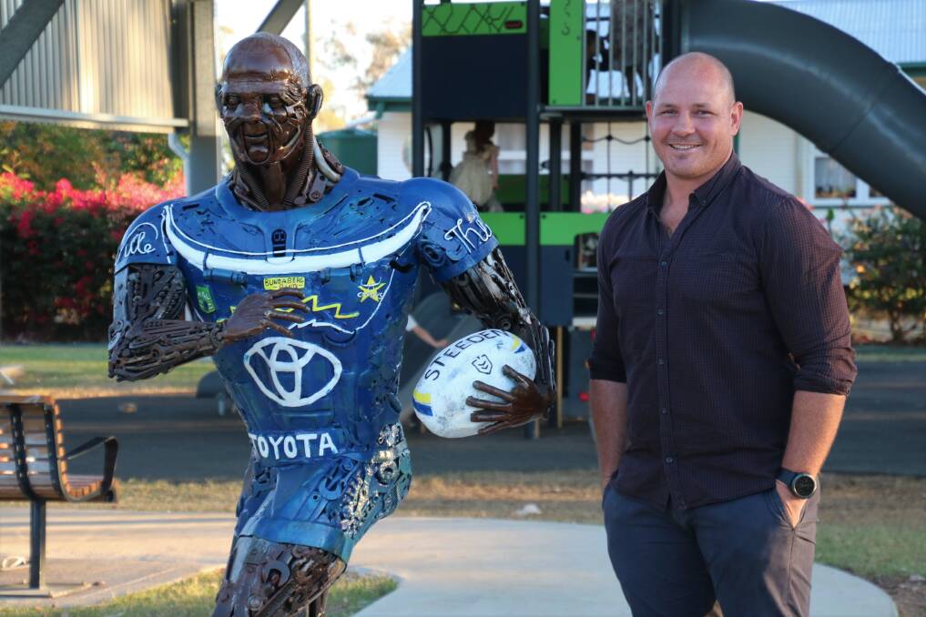 Former North Queensland Cowboys co-captain Matt Scott admires his likeness, now a permanent fixture in Ilfracombe's park. Photo: supplied