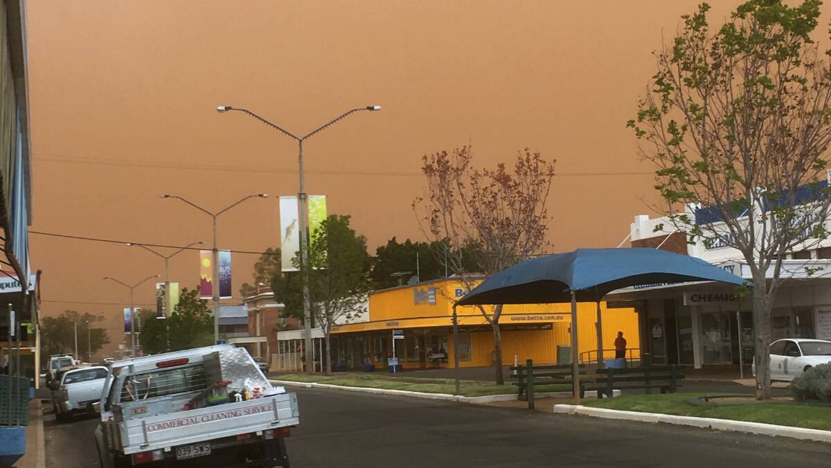 Street lights were on in downtown Charleville as the dust storm cut visibility. Photo by Lesley MacDonald.