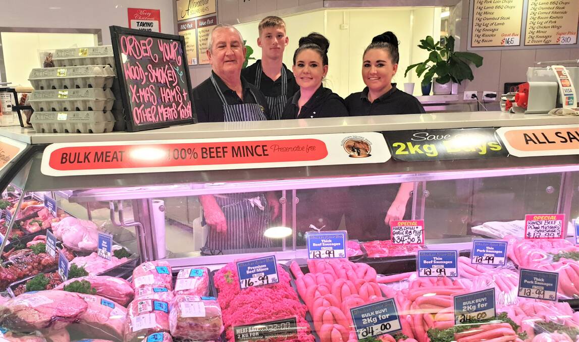 Rockhampton butcher Geoff Elliott, with his daughters Leah and Hayley plus Jye Murphy, says the large majority of his customers' purchases are beef. Picture: Sally Gall
