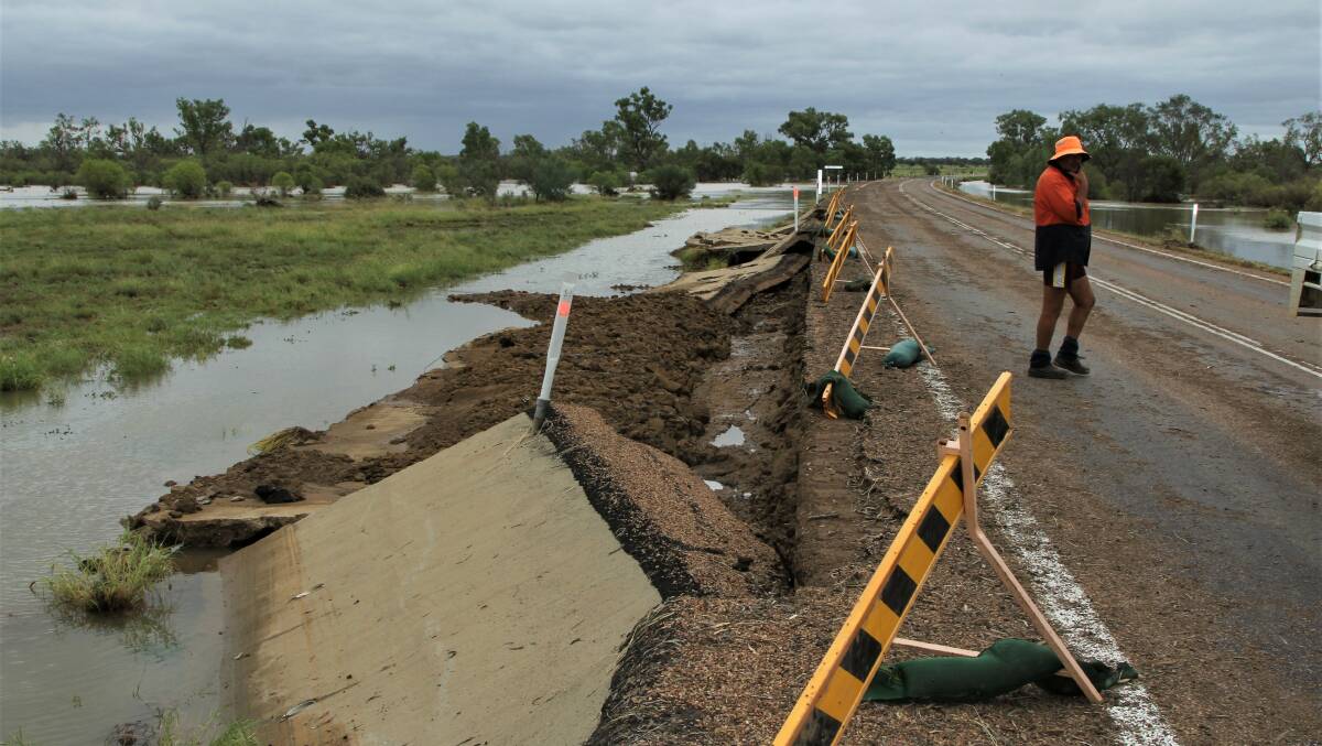 Blackall-Tambo council staff inspecting damage caused by overnight flash flooding on the Landsborough Highway at Skeleton Creek. The water overtopped the crossing, which is higher than it came in the record 1990 flood. Picture - Sally Gall.