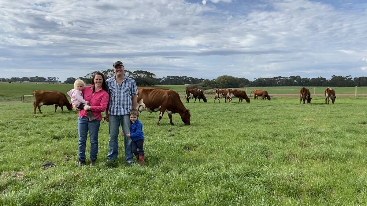 FAMILY: Bronwyn and Brett Davies with their children Kaiah and Levi in front of some of their Aussie Red herd.
