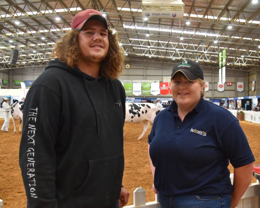 EXCHANGE: Holstein youth exchange scholarship recipients Oakey Henry and Catherine Bunting watching the judging at International Dairy Week in January.}