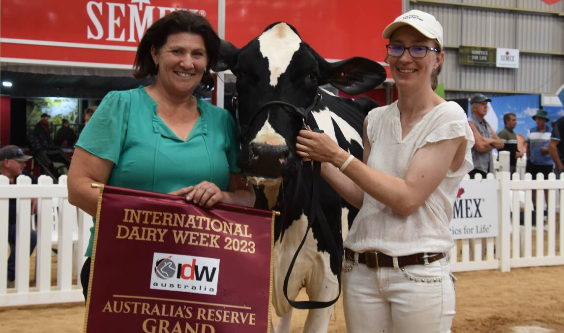 Friends Maree Deneen and Alex Mathews with their 2023 International Dairy Week Holstein senior champion cow Avonlea Stanleycup Evie. Picture by Carlene Dowie