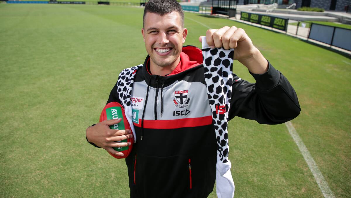 SOCK IT TO ME: St Kilda ruckman Rowan Marshall, who spent time growing up on a dairy farm in south-west Victoria, says he is proud to support the industry. 