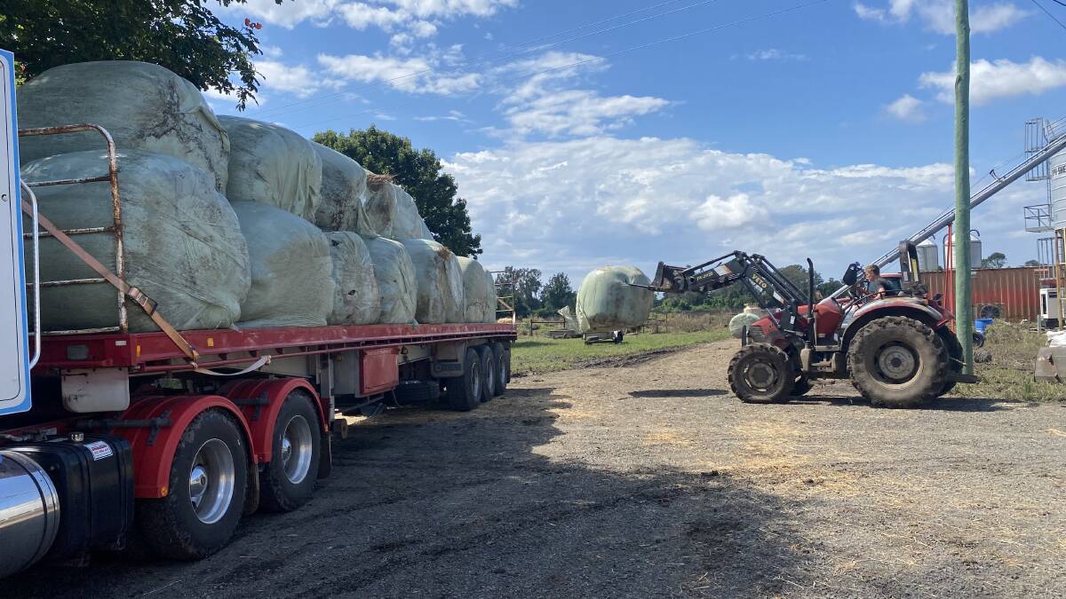 Bales of silage being loaded up to help flood-affected farmers. Photo Peter Markey