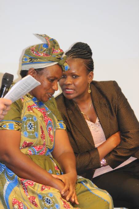 Josphine Mukiri speaking with her interpreter at Bayer's Future of Farming Dialogue in Germany in September. 
