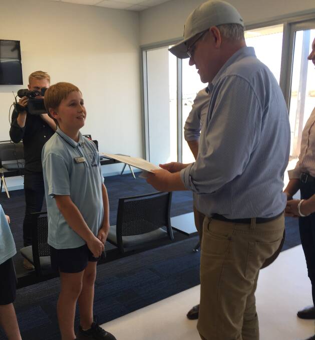 Quilpie school children greeted the Prime Minister, Scott Morrison, when he arrived at the airport on Monday. 