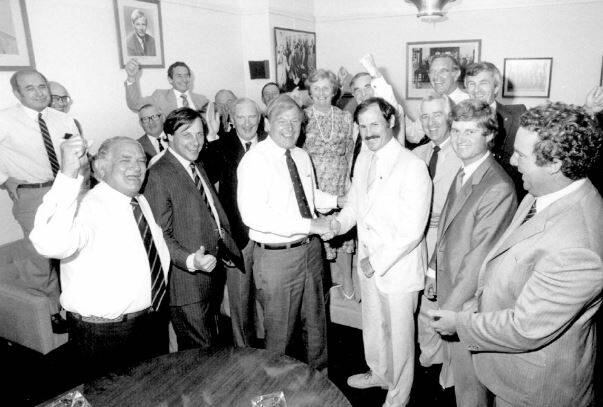 On 14 March, 1983, the federal parliamentary party room welcomed the return of Noel Hicks after a bruising campaign in his NSW seat of Riverina.
Left to right (back row): Bruce Lloyd, Ray Braithwaite, Bruce Cowan, Tom McVeigh, Doug Scott, Ian Robinson, Ian Cameron, Flo Bjelke-Petersen, Ralph Hunt, Ian Sinclair, Stan Collard, Peter Fisher; (front row): Bob Katter (snr), Stephen Lusher, Doug Anthony, Noel Hicks, Peter McGauran and Ron Boswell.