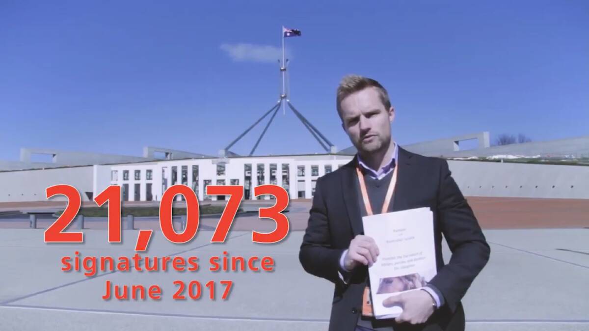 RSPCA Australia Senior Policy Officer Dr Jed Goodfellow delivering an anti-live exports petition to Parliament House yesterday.