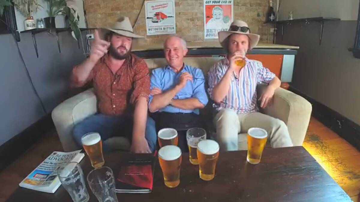 Malcom Turnbull (centre) sharing a beer with Clancy Overell and Errol Parker, from The Betoota Advocate.