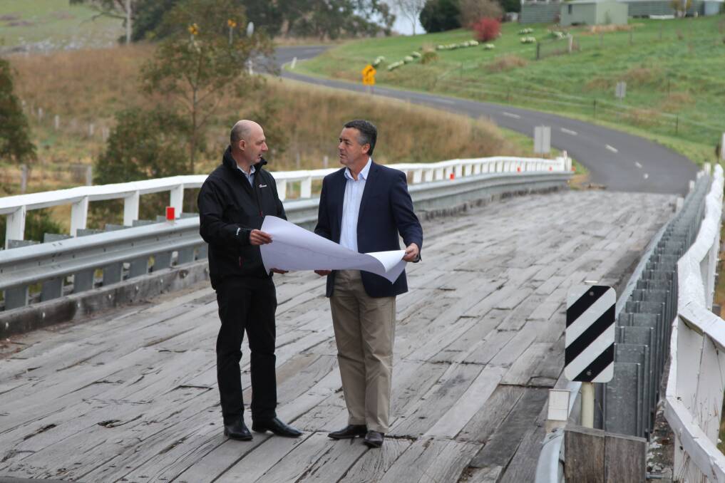 Transport Minister Darren Chester (right) with Chris Waites of East Gippsland Shire Council, on the Buchan River bridge on the Buchan Orbost Road, in Victoria.