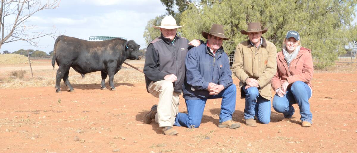 The 890kg Waitara General N87 sold for $10,000 to Trio Angus, Cassilis. Pictured is John Settree, Landmark Dubbo, vendor Steve Chase and buyers Matt Cherry and Shelley Piper.