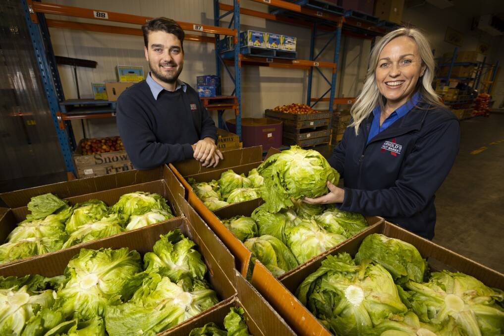 LIMITED: Arnold's Fruit Market general manager Ben Arnold and marketing and promotions manager Louise Arnold have continued to sell iceberg lettuce but supply isn't meeting demand for the Wodonga retailer. Picture: Ash Smith