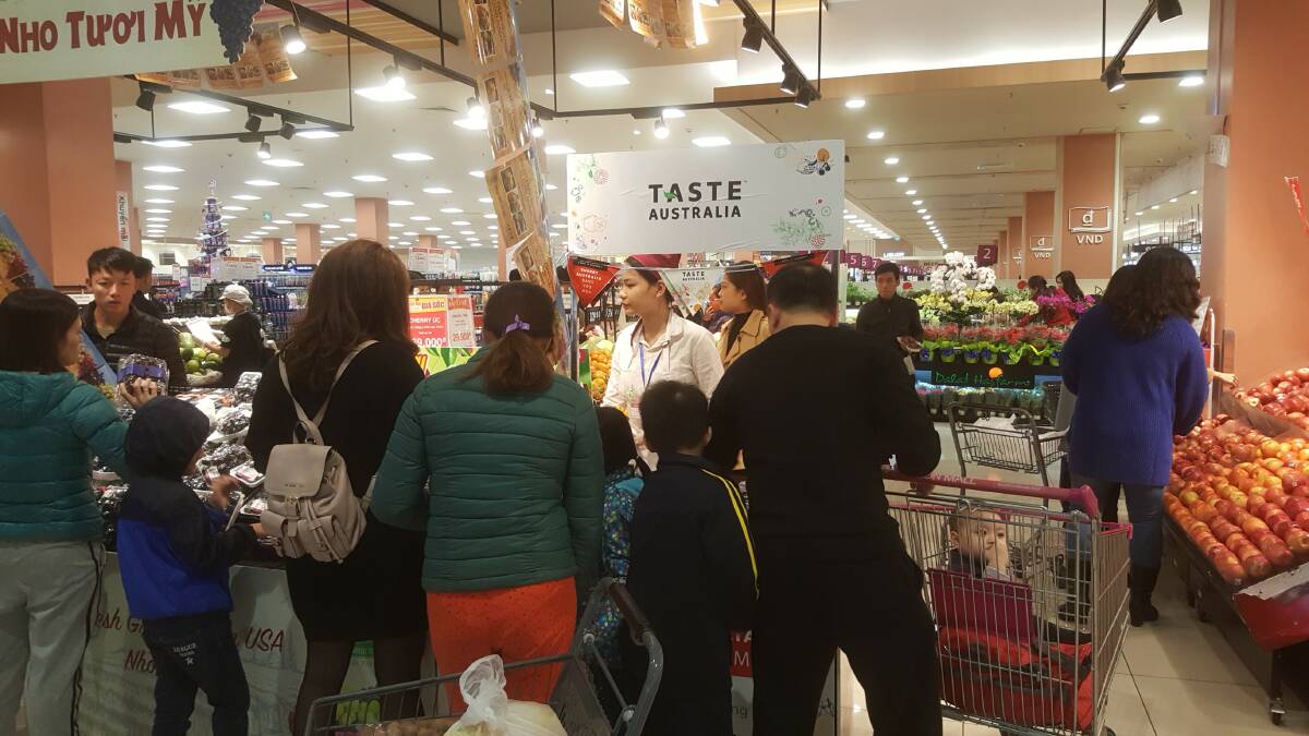 IN STORE: Shoppers in Vietnam stop by for a tasting of Australian produce as part of the Taste Australia campaign which looks to promote export links and open doors for producers. 