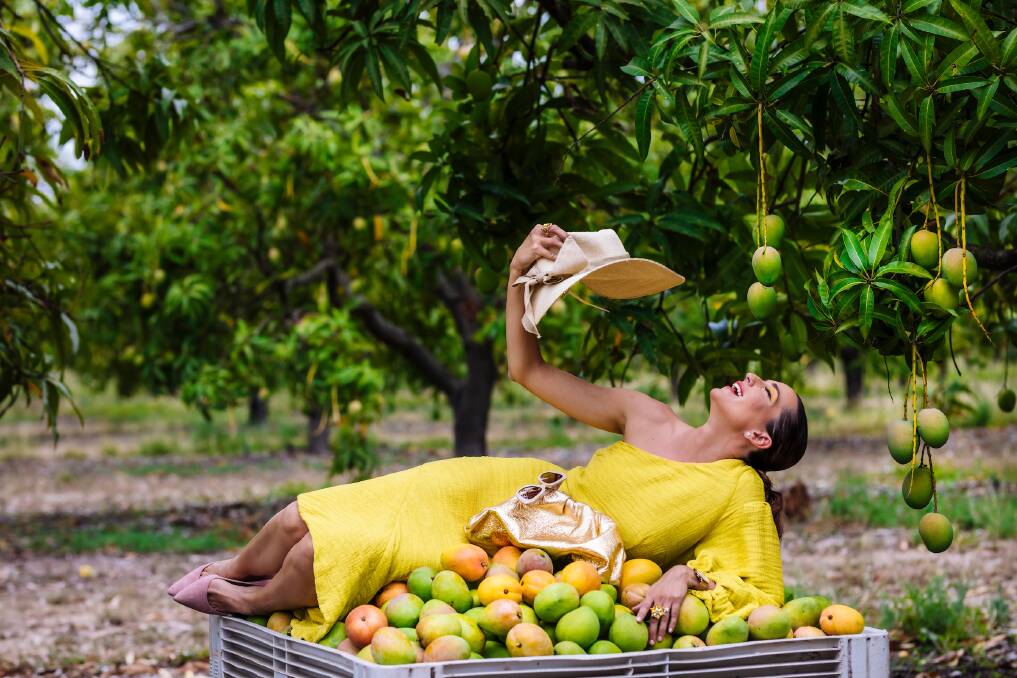 MODEL: Loretta Bowen from Sandy Cove Mango Plantation poses for the special mango calendar. 