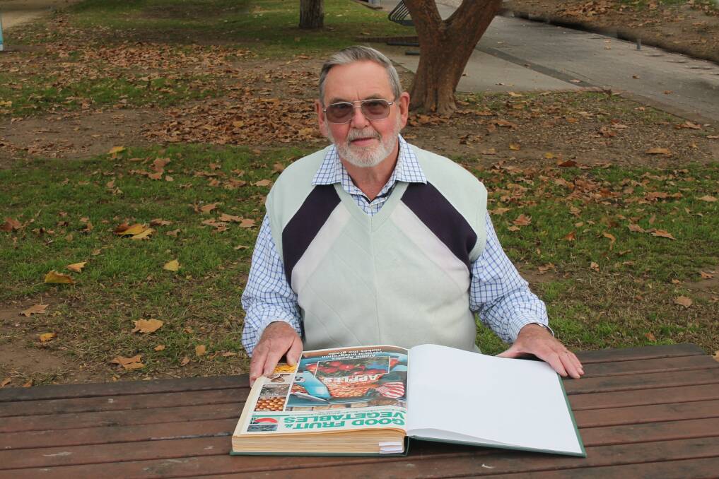 FIRST: Inaugural editor of Good Fruit & Vegetables magazine, Tony Biggs, North Richmond, NSW, looks over bound copies of the very first editions. Mr Biggs edited the magazine for 13 years from 1990. Photo: Kelvin Tsui, Rabbit Photo Richmond.