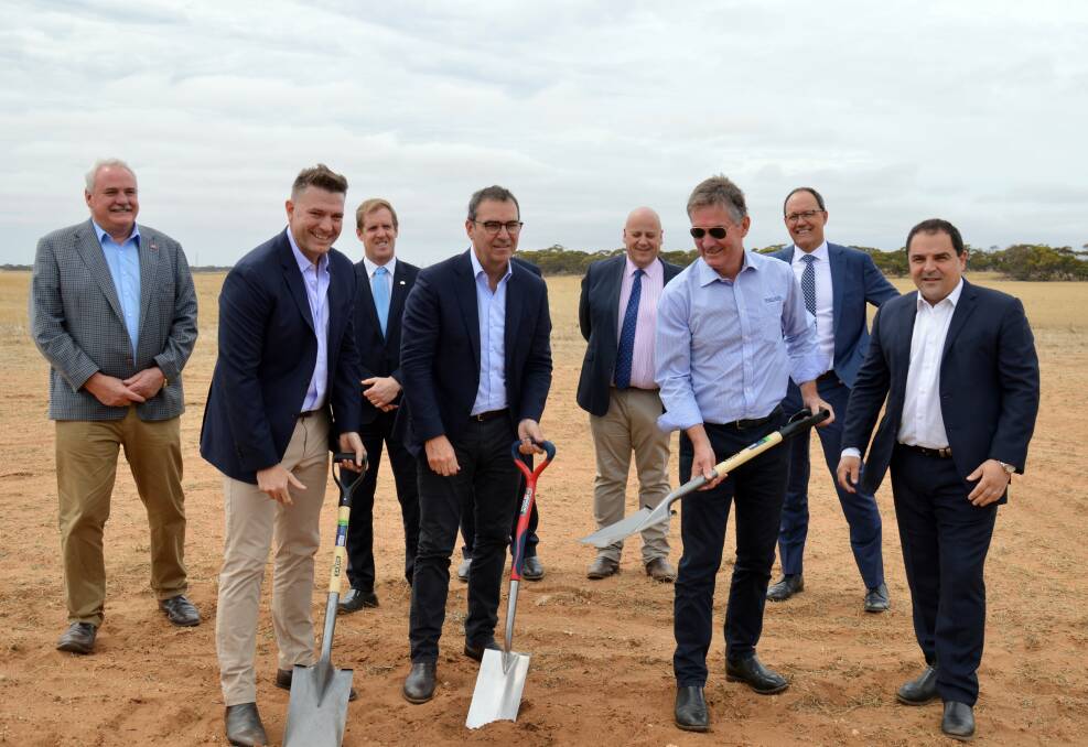 KEY STEP: TFI CEO Darren Thomas, SA Premier Steven Marshall and BADGE managing director Jim Whiting prepare to turn the first sod, surrounded by official guests.