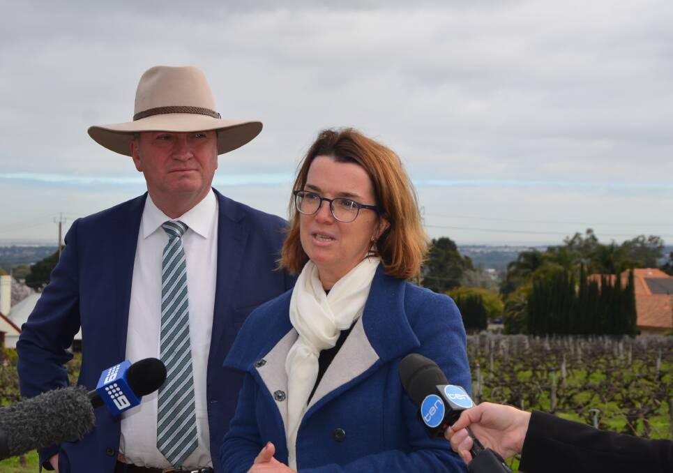 BOTTOMS UP: Agriculture Minister Barnaby Joyce and Agriculture Assistant Manager and SA Senator Anne Ruston at the launch of the export and regional wine support package at Penfolds Magill Estate, Adelaide.