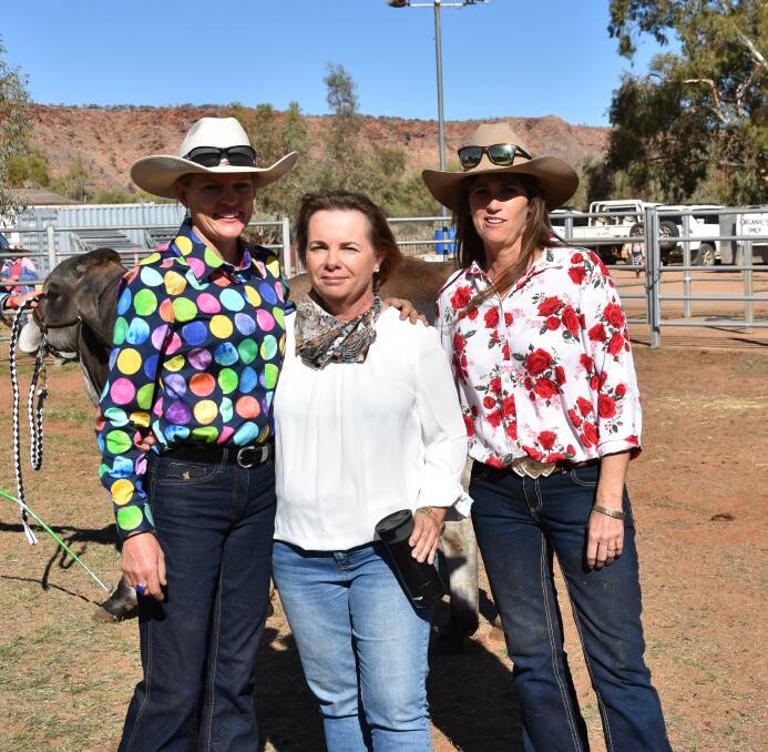 SKY WATCH: Anna Weir, Ammaroo Station, Sheri Fogerty, Palmer Valley Station, and Nicole Hayes, Undoolya Station, catch up at the Alice Springs Show, NT, where the weather was a central topic of conversation.