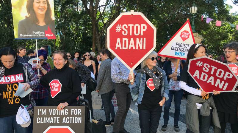 Protesters outside Queensland Parliament called for Adani's Carmichael Mine to be rejected on Tuesday. Photo: Bruce Currie