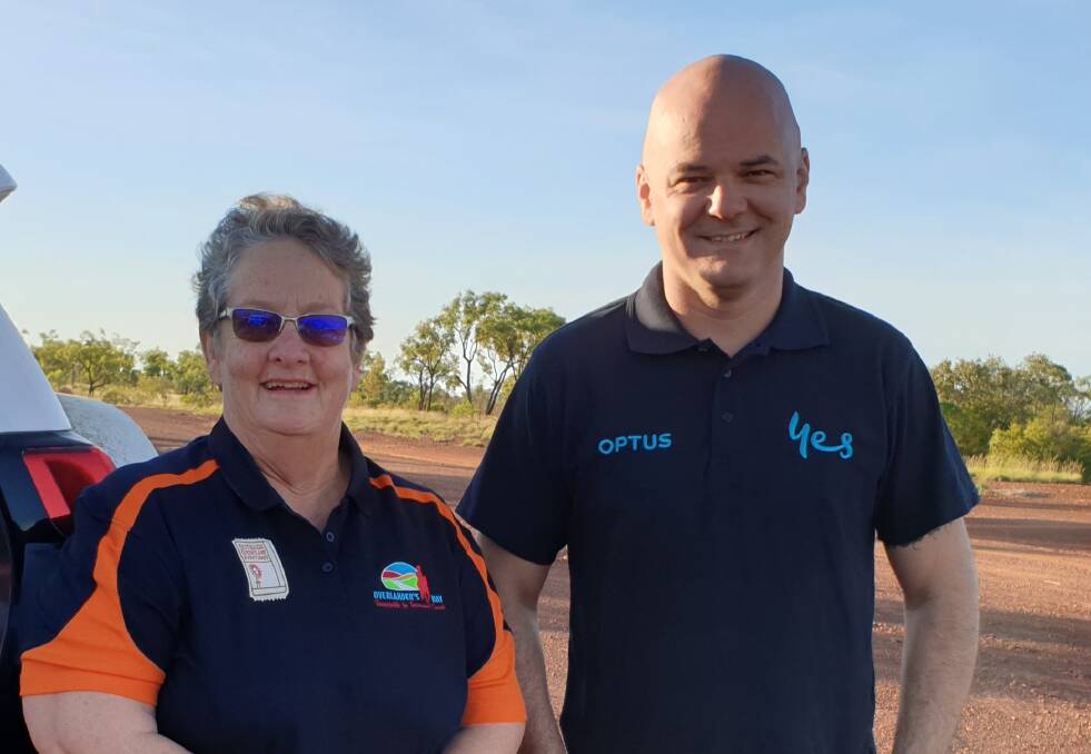 In service: Jane McNamara with Dave Morrissey on the Flinders Highway which is now fully blanketed by the Optus mobile network.
