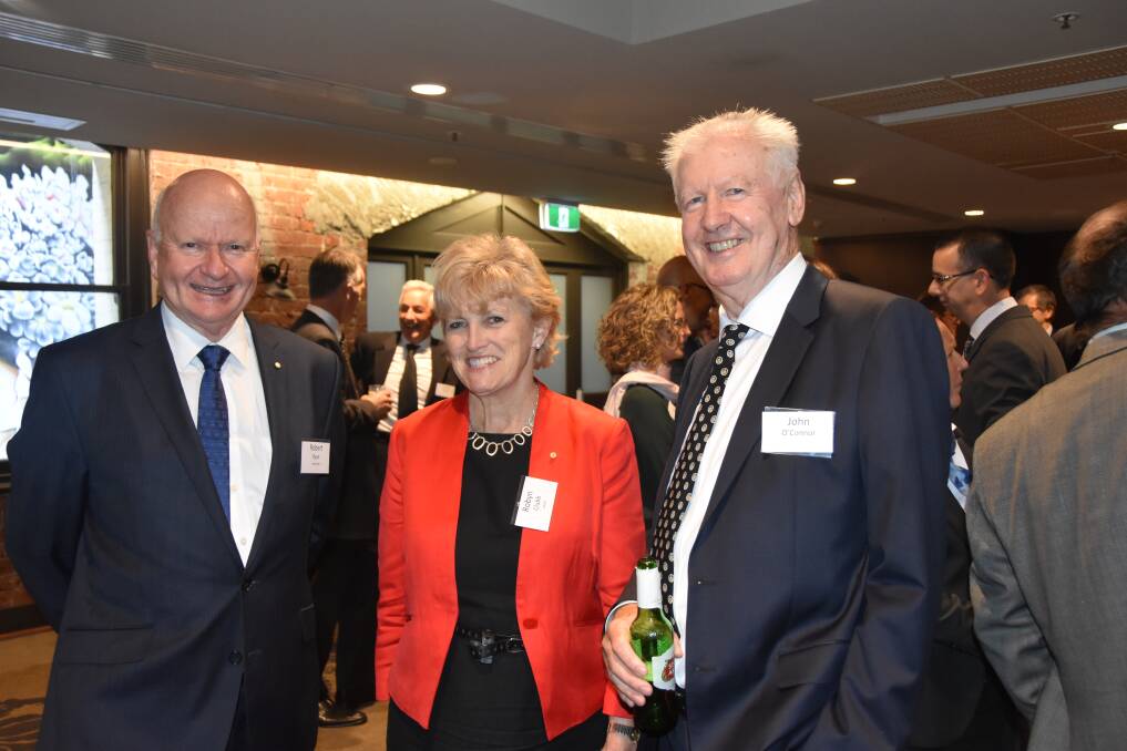 ALL SMILES: Robert Ryan, managing director of Schute Bell Badgery Lumby, Sydney, with Robyn Clubb, chair of AWEX, Araluen, NSW, and former executive director of the NCWSBA, John O'Connor. 