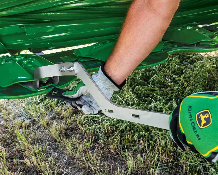 FINGER DAMAGE: John Deere says farmers can replace a worn or damaged knife in only a few seconds with the new quick change knife system.