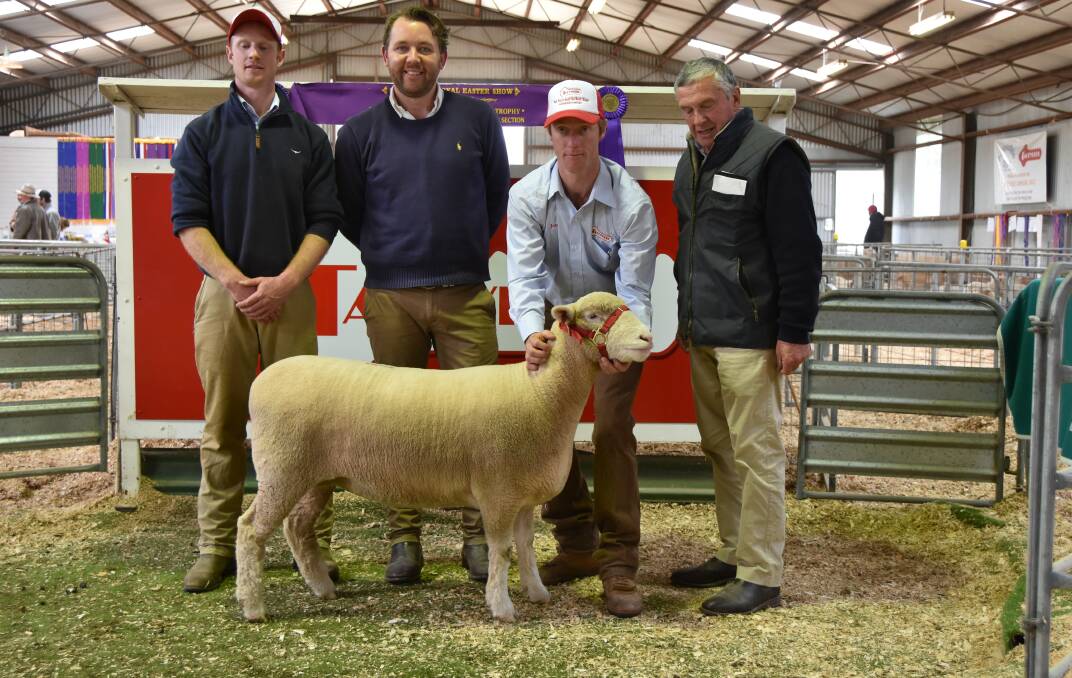 A SPECIAL EWE: Ross Gilmore, auctioneer Miles Phitzner, James Gilmore and buyer, Kerry Davis, with the top ewe. 