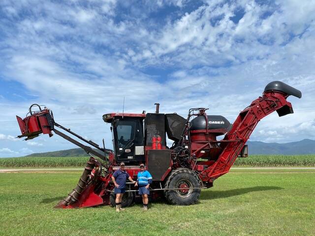 MEN AT WORK: Gary Stockham, right, and son Ashley with their Austoft 8810 cane harvester.