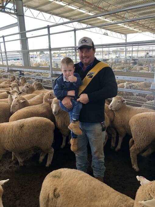THUMBS UP: Danny Maher and son, Tommy, Precision Production, Dean, with their $378 heavy export lambs at Ballarat on Tuesday. 
