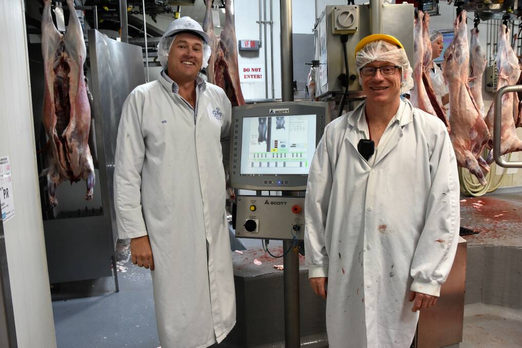 REARING TO GO: Will Barton, CEO of Gundagai Meat Processors, and lamb floor manager, Jason Crane, with the plant's DEXA unit which measures lean carcase yield. 