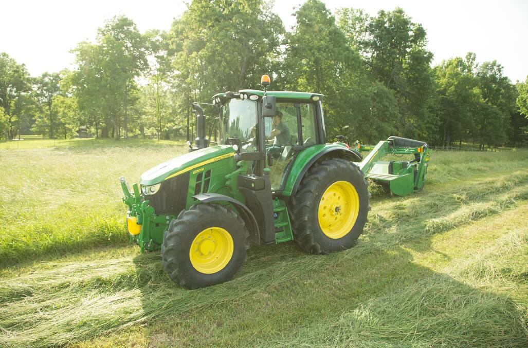 UTILITY TRACTOR ON TRACK: John Deere 6M tractors can now be ordered with an AutoTrac guidance screen built into the cabin corner-post.