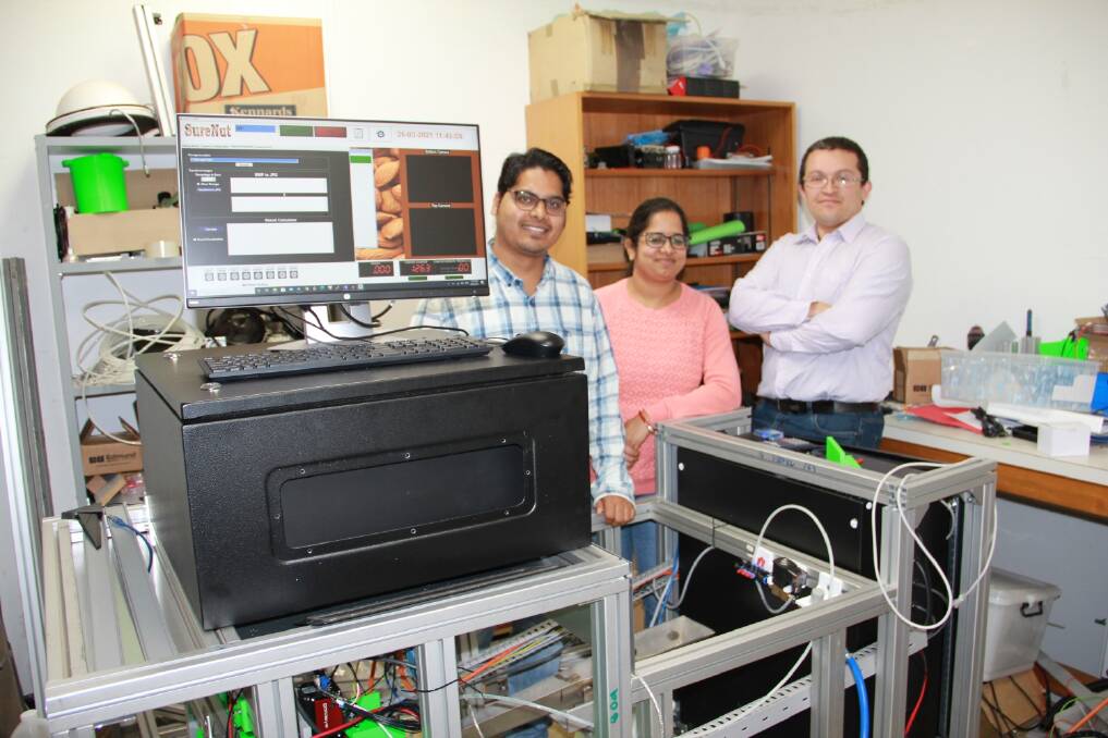 THE A(lmond) TEAM: University of South Australia researchers Brajesh Panda, Gayatri Mishra and Wilmer Ariza with their prototype almond grading and contaminant detection machine. 