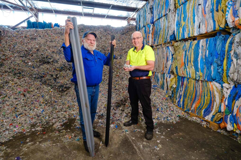 PLASTIC FANTASTIC: Tumbarumba, NSW, beef producer Steve McKay with David Hodge from Plastic Forests and steel-reinforced plastic fence posts made from recycled soft plastics. 