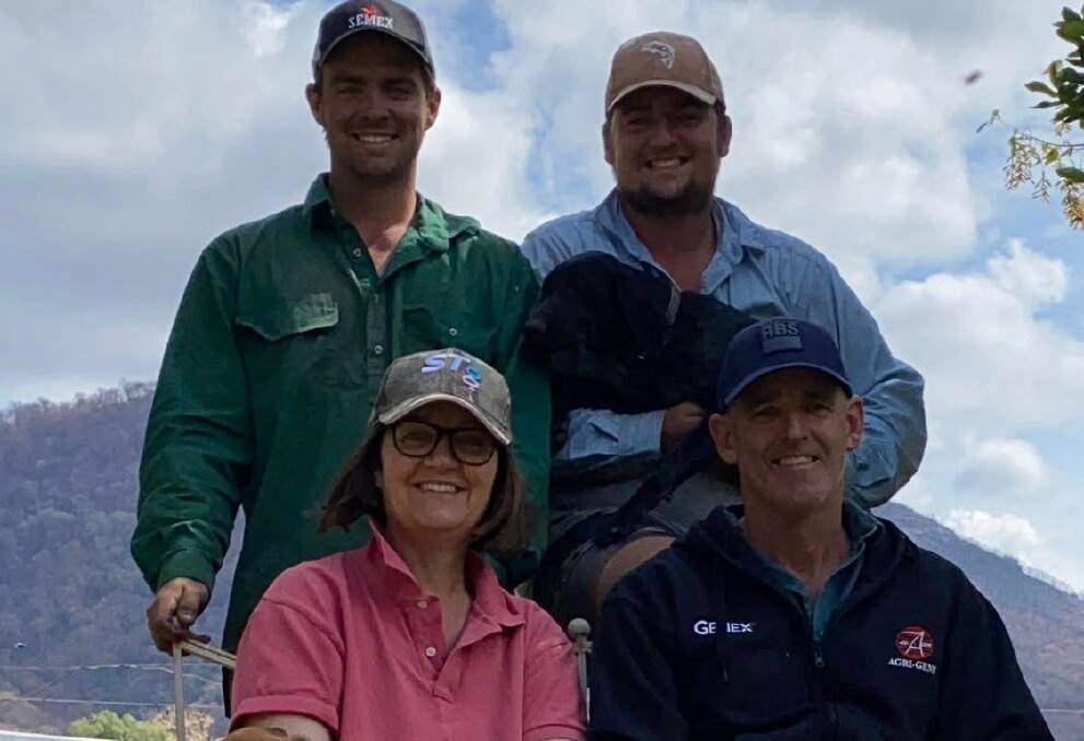 We are family ... Cudgewa dairy farmers Elise and James Hill with their sons Jake and Sam (top right) pictured after they fought the devastating bushfires that tore through their Upper Murray property at the start of 2020.