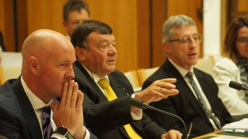 
AWI chief executive Stuart McCullough, AWI chairman Wal Merriman and Department of Agriculture secretary Daryl Quinlivan, during Senate Estimates in Canberra.