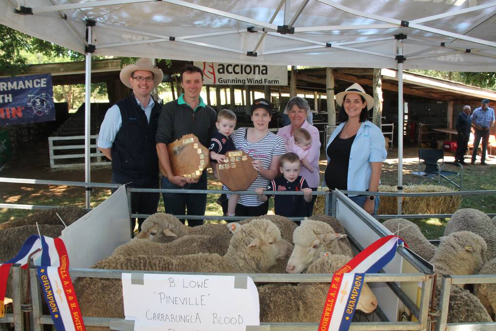 TOP FLOCK: The winning ANZ Agribussiness Crookwell Flock Ewe entry went to the Lowe family of 'Pineville', Crookwell. Pictured is Andrew Tweekee of ANZ Agribusiness, Brian, Jack, Maddy, Henry, Virginia and Ava Lowe all from 'Pineville' and Adele Fiene, ANZ Agribusiness specialist. 