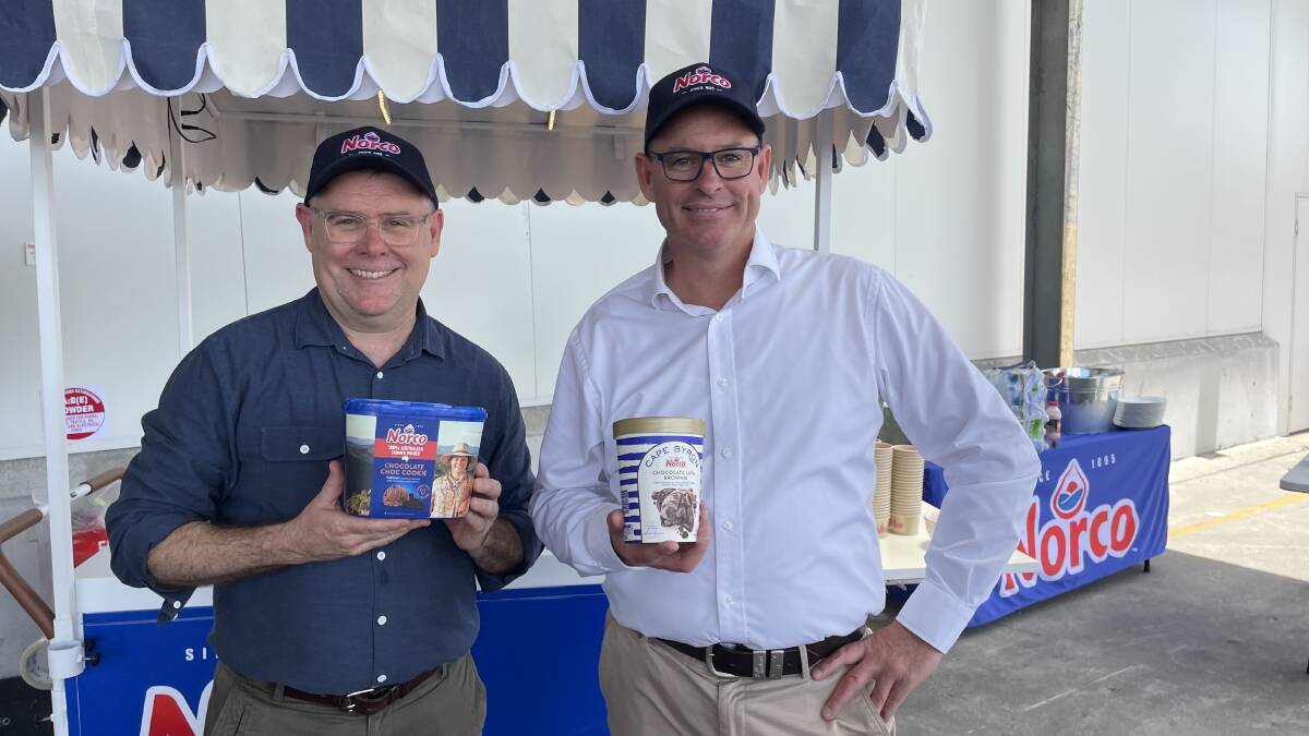 Norco chief executive officer Michael Hampson, right, with federal agricultural minister Murray Watt at the re-opening of the flood-ravaged Norco ice cream factory. Woolworths says it will continue to sell Norco ice cream. File photo.