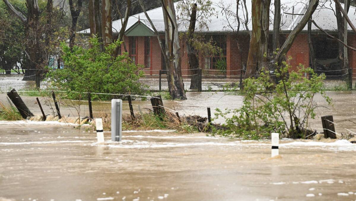 Floodwater is seen close to residential properties near Strathfieldsaye, Bendigo in Victoria. Picture by AAP Image/James Ross