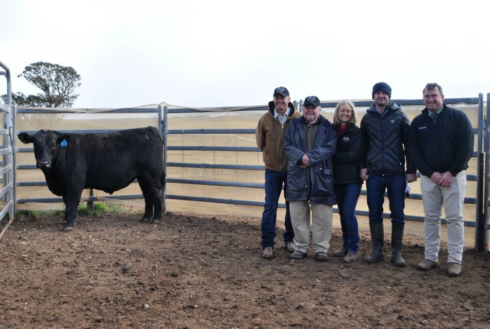 One of the $10,000 bulls of the sale, Myanga Xcalibur P24 with Myanga Angus stud principals Stephen and Sally Dunne, Landmark's Tim Woodham and top buyers John McIntosh, Laggan and Alan McCormack, Gurrundah. 